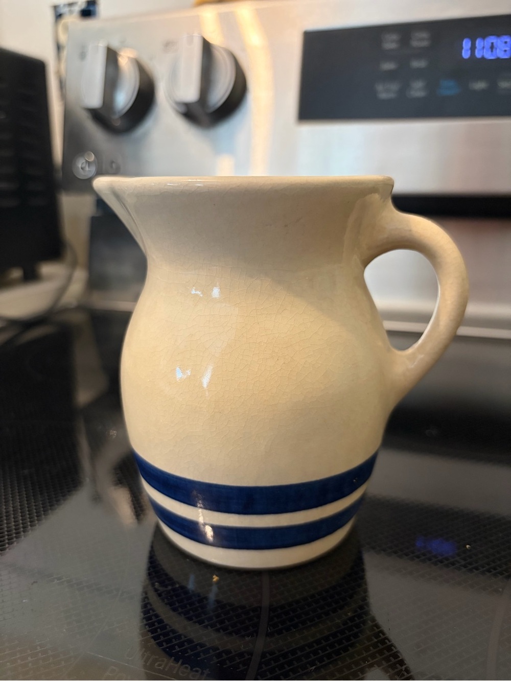 Robinson-Ransbottom Cream Ceramic Pitcher with Navy Blue Bands
